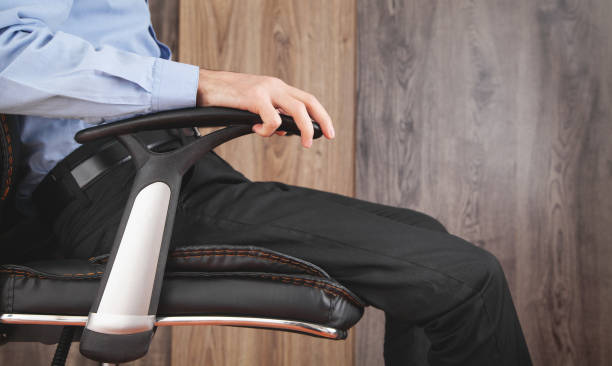 Adjustable office chair beside height-adjustable desk